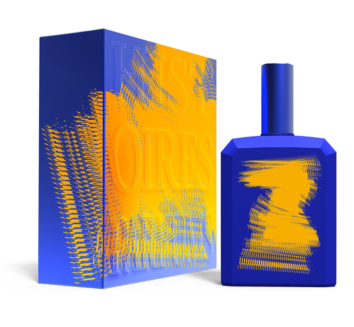 A perfume bottle of This is not a blue bottle 1/.7 -115ml next to its packaging box.
