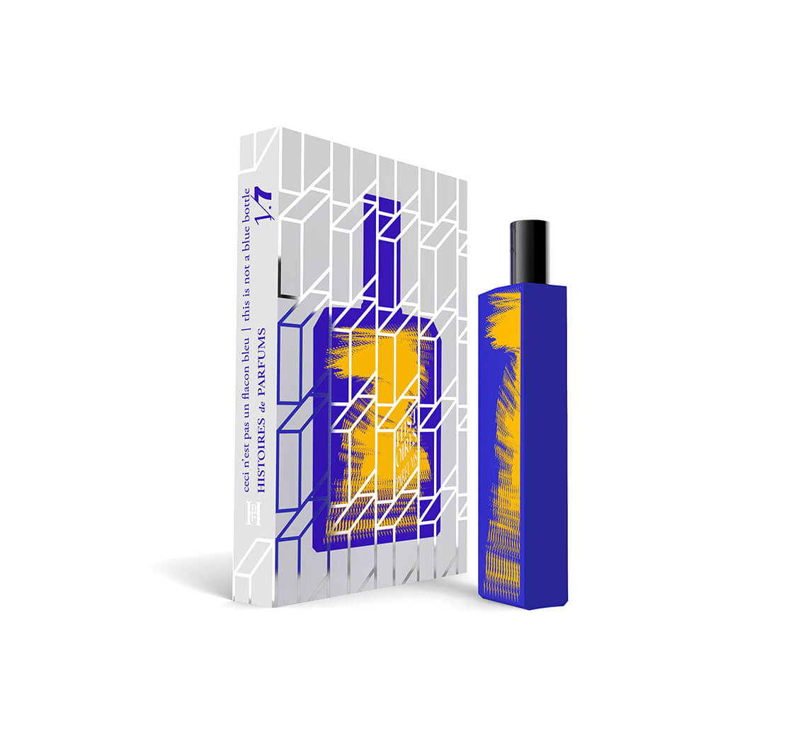 A perfume bottle of This is not a blue bottle 1/.7 - 15ml next to its packaging box.