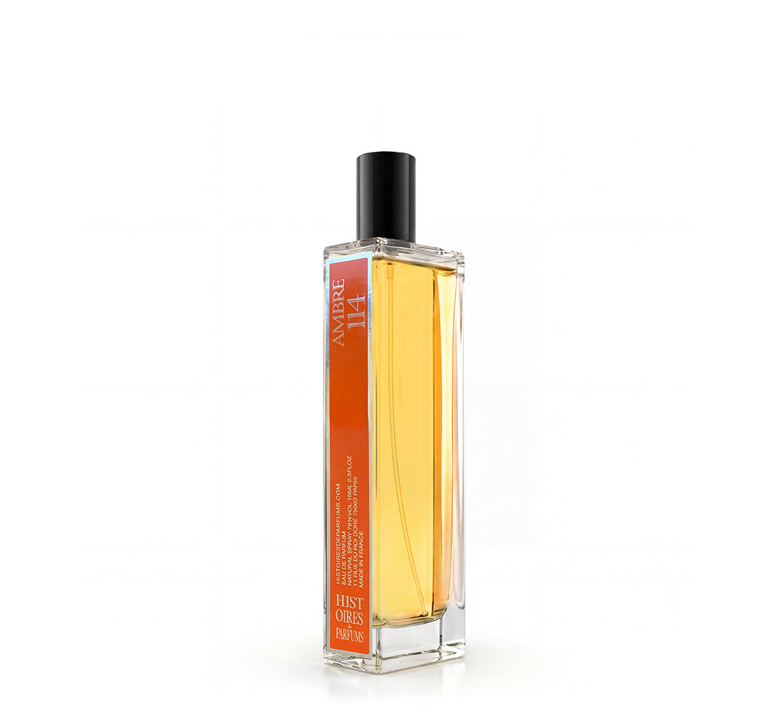 A Ambre 114 glass perfume bottle with a black cap on a white background.