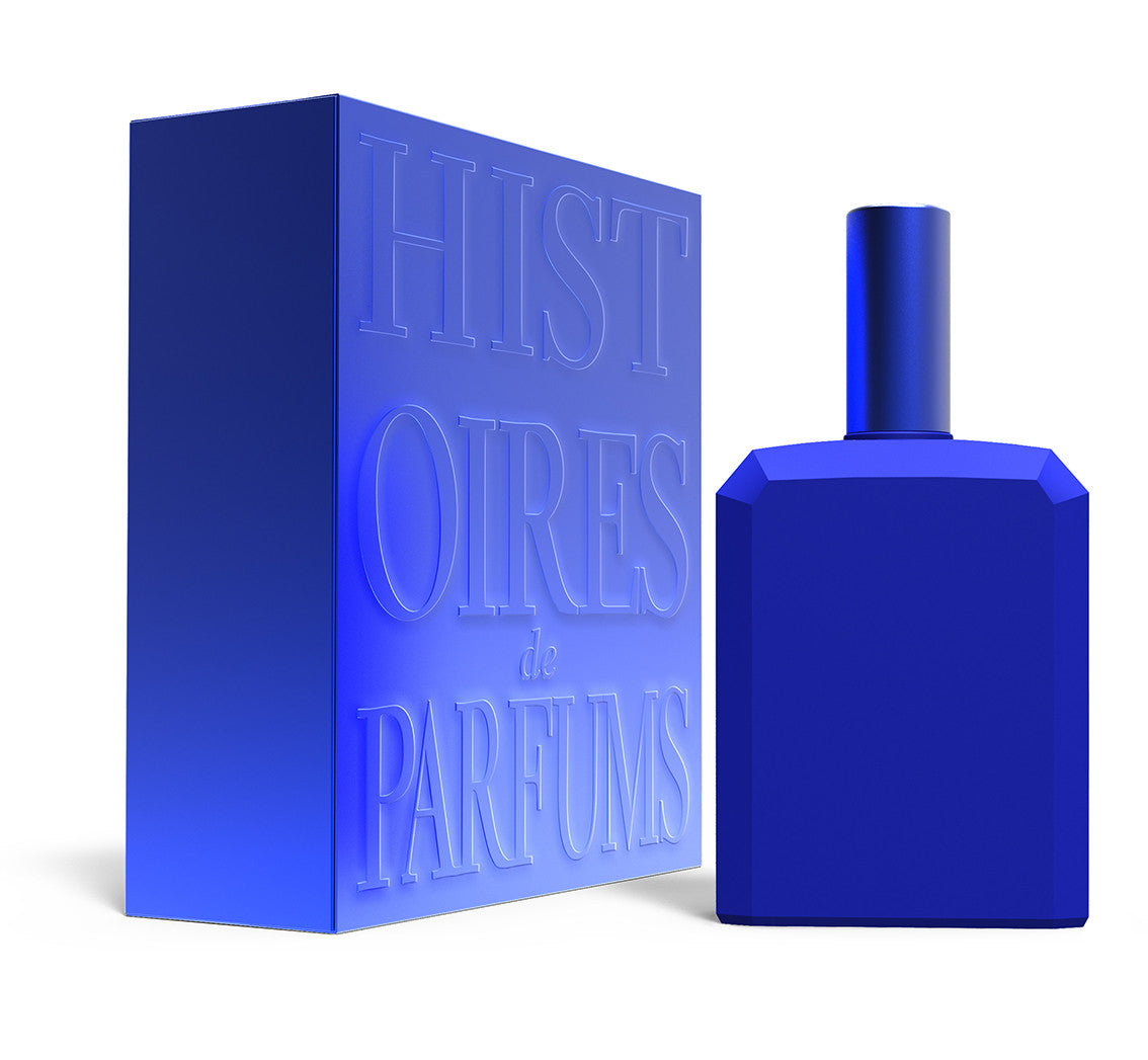 A perfume bottle of This is not a blue bottle 1/.1 - 115ml next to its packaging box.