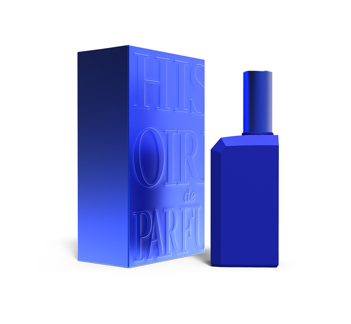 A perfume bottle of This is not a blue bottle 1/.1 -60ml next to its packaging box.