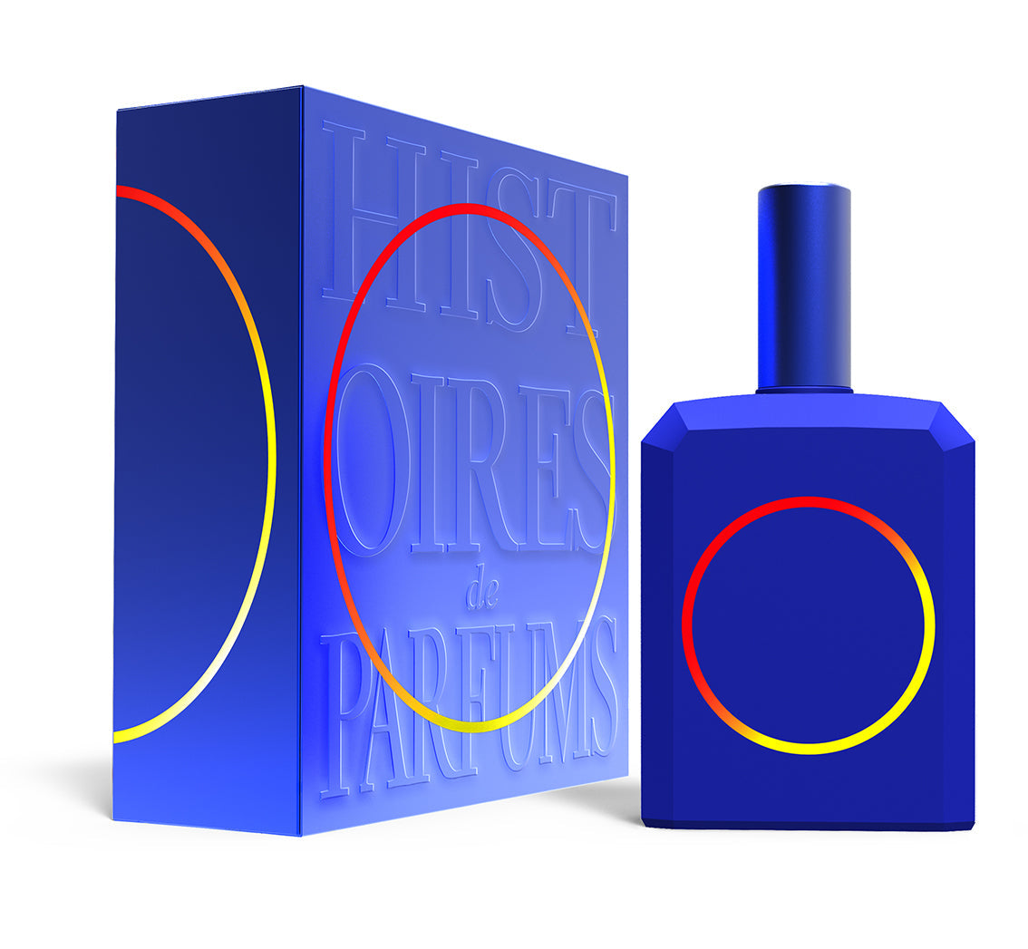 A perfume bottle of This is not a blue bottle 1/.3 - 115ml next to its packaging box.