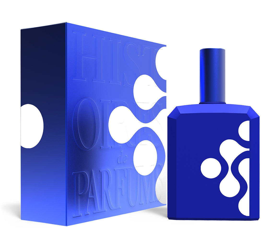 A perfume bottle of This is not a blue bottle 1/.4 - 115ml next to its packaging box.