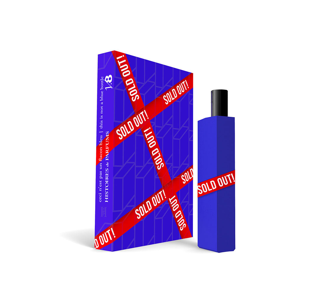 A perfume bottle of This is not a blue bottle 1/.8, Sold Out! Le Parfum - 15ml next to its packaging box.
