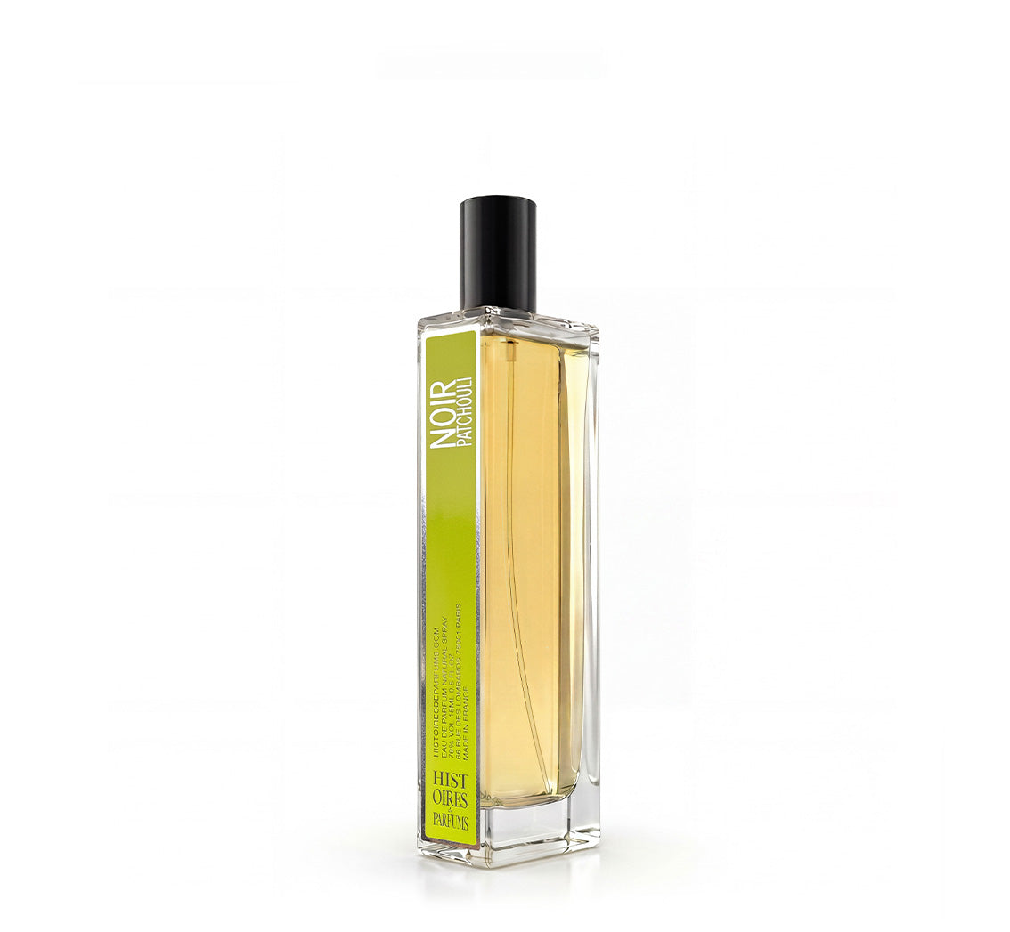 A Noir Patchouli glass perfume bottle with a black cap on a white background.