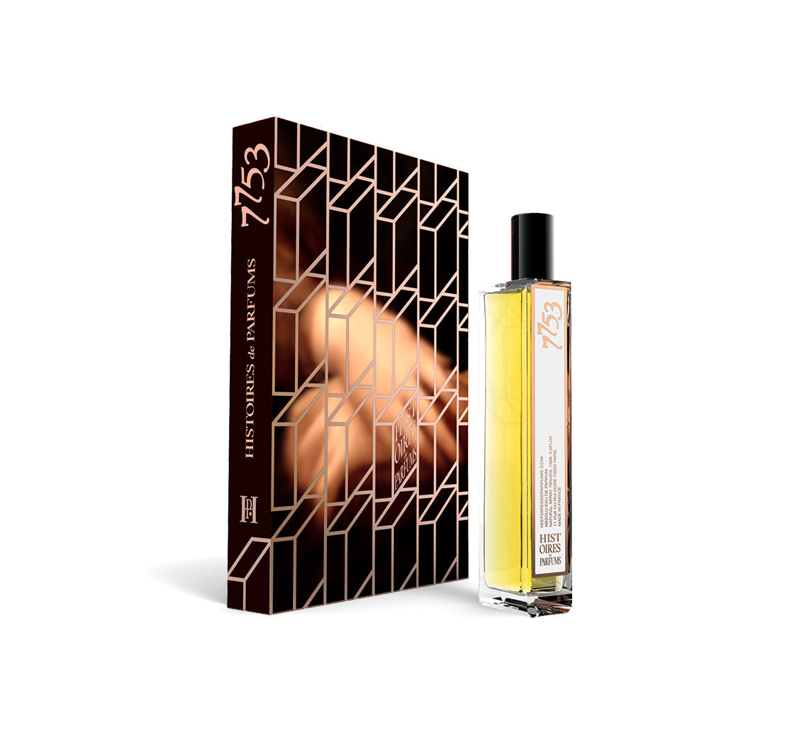 A perfume bottle of 7753 - 15ml next to its packaging box. 