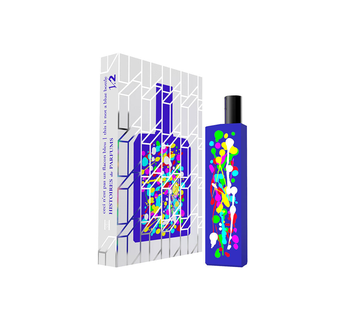 A perfume bottle of This is not a blue bottle 1/.2 - 15ml next to its packaging box. 