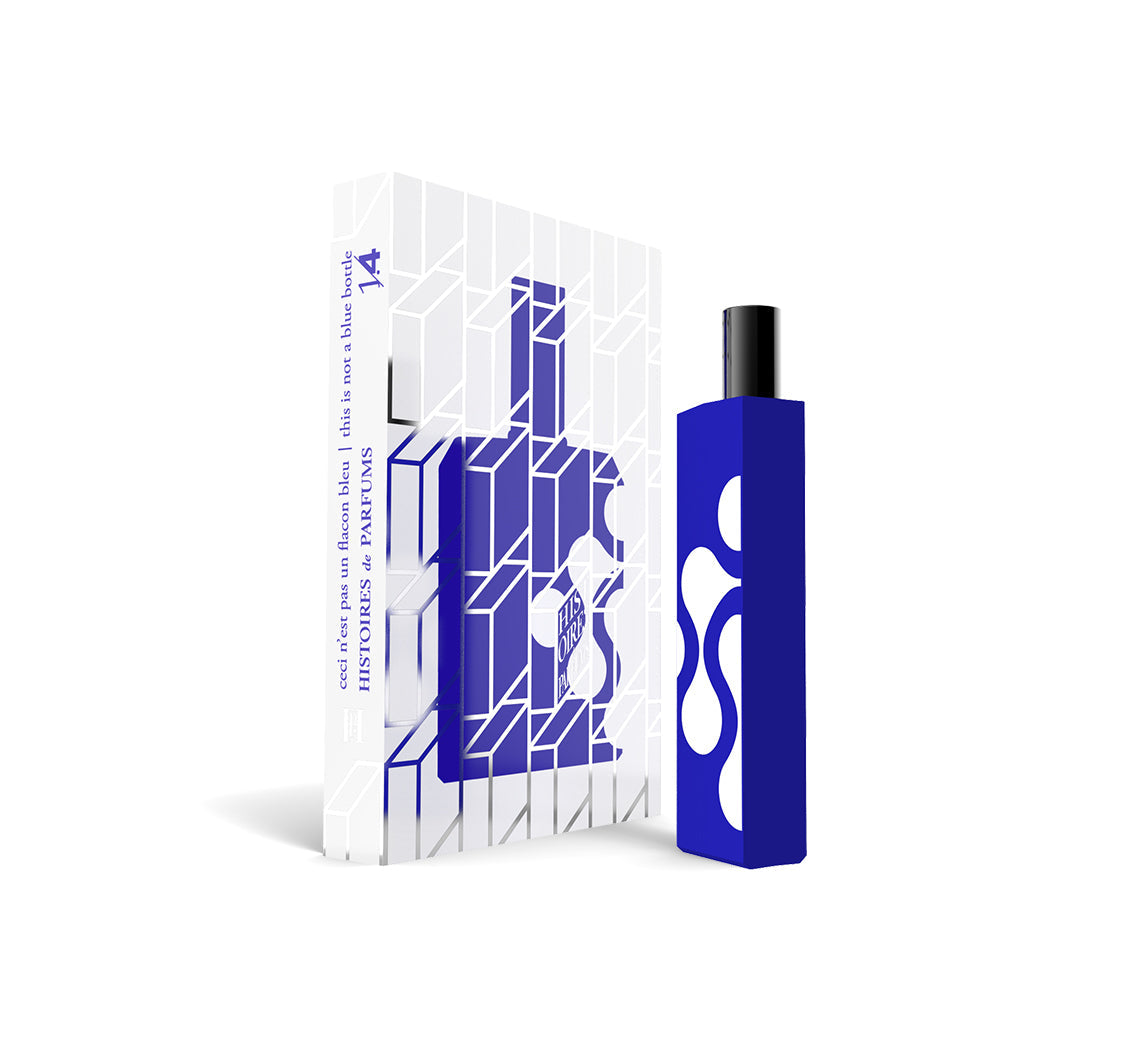 A perfume bottle of This is not a blue bottle 1/.4 - 15ml next to its packaging box. 