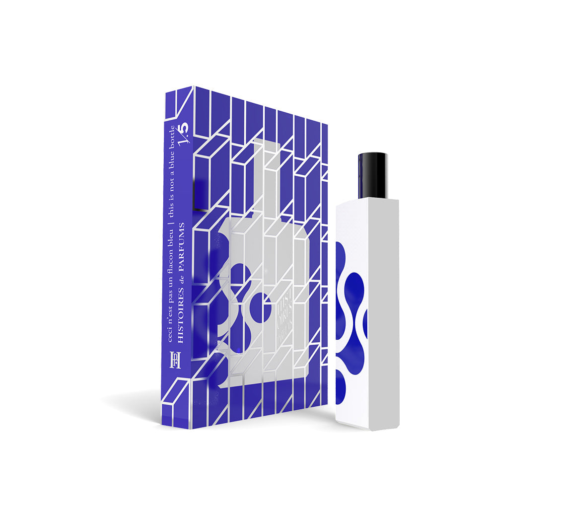 A perfume bottle of This is not a blue bottle 1/.5 - 15ml next to its packaging box. 