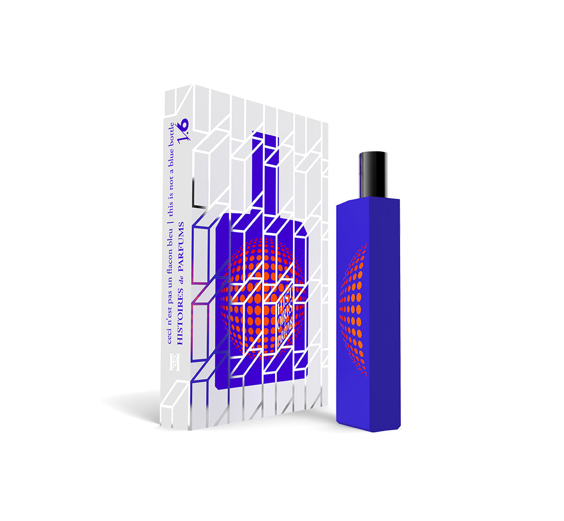 A perfume bottle of This is not a blue bottle 1/.6 - 15ml next to its packaging box. 